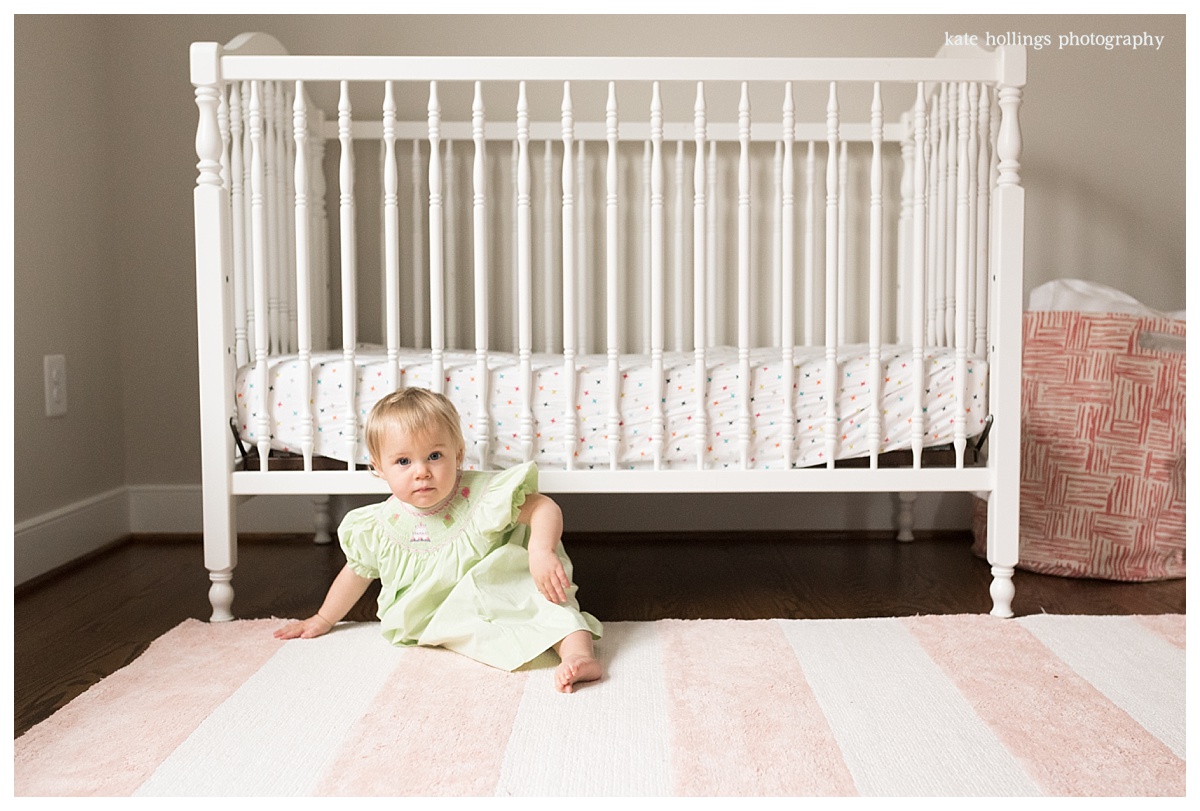 Baby girl hangs in her nursery