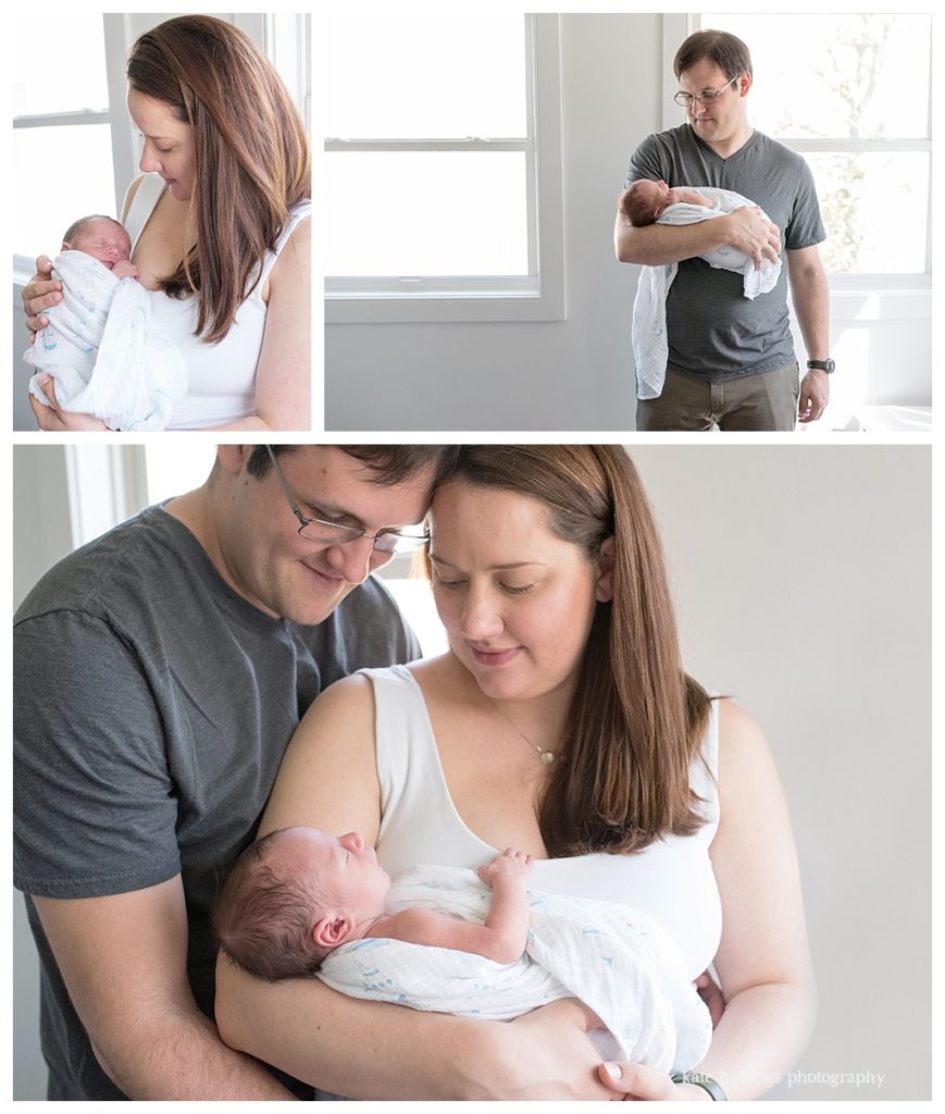 Mom and dad hold baby in the nursery