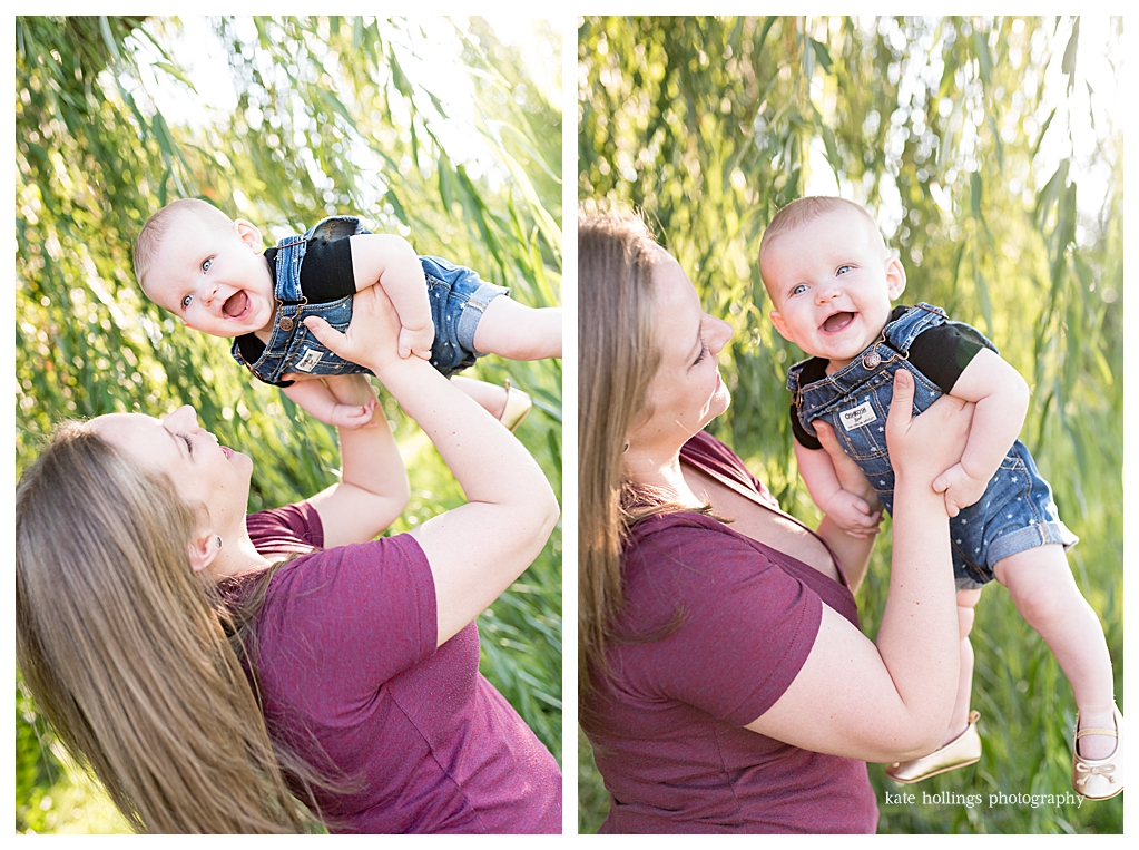 Mother holds her six month old in outside photo session