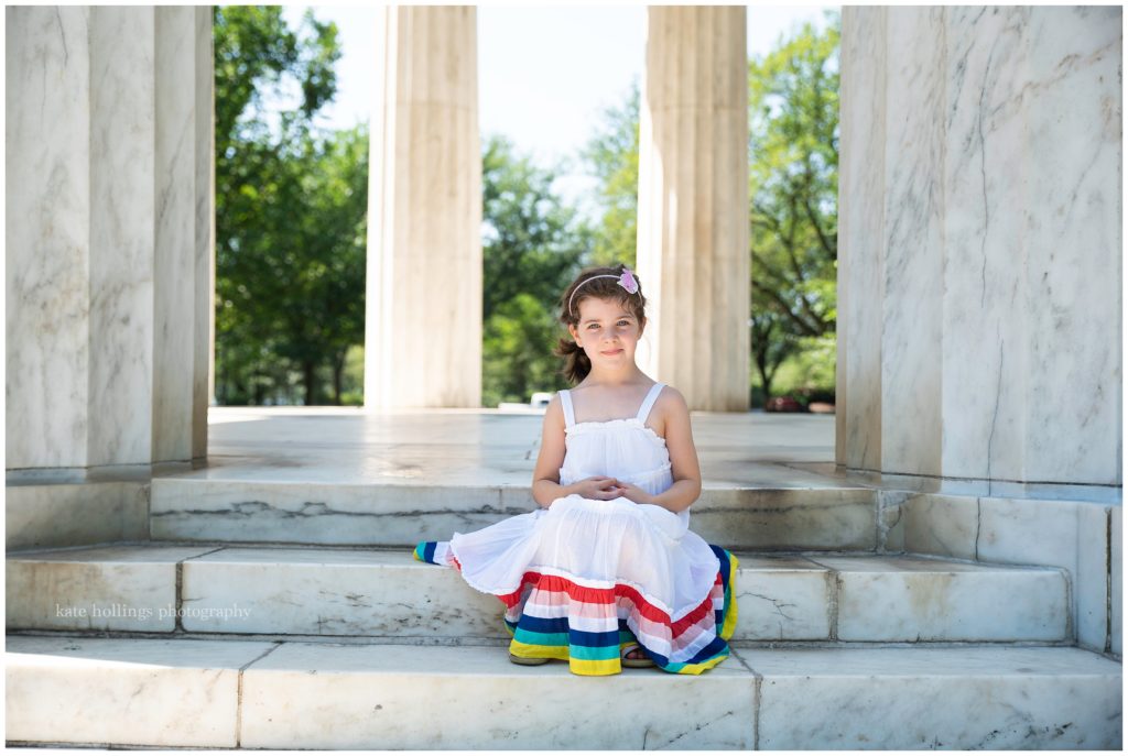 Girl sits serenely at DC War Memorial