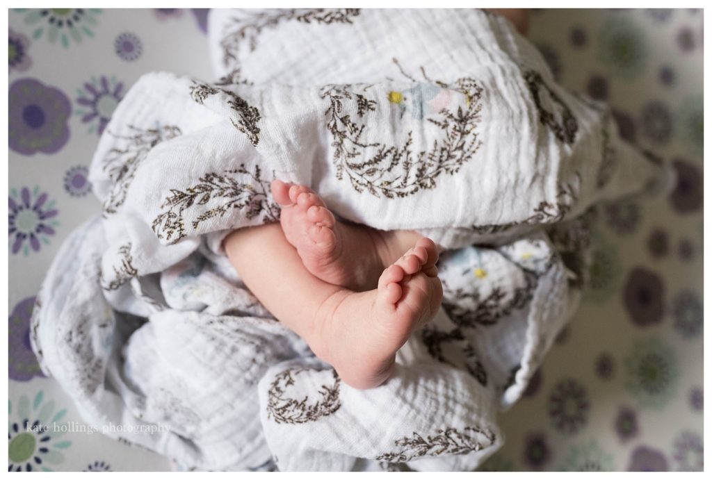 baby's feet peak out of swaddle
