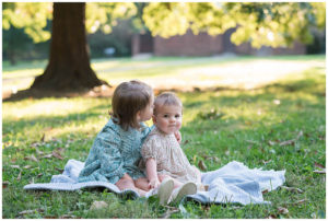 Big sister gives baby a kiss in DC photo session